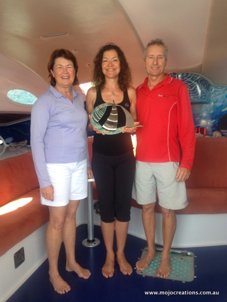 Jo presents her engraved keeper trophy to the overall winners of the Multihull Soultions Whitsunday Rendezvous - Debbie and Warren Kerswill off Phase 2